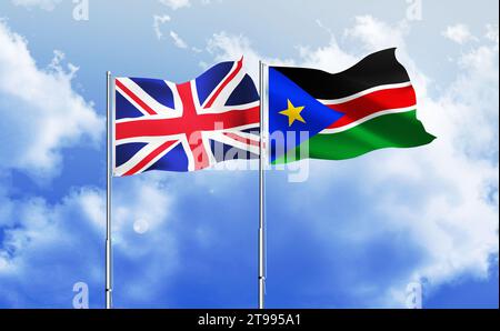 South Sudan,UK flags together waving against blue sky Stock Photo