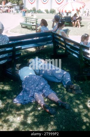 SACRAMENTO, CA - AUGUST, 1958: A man runs to help the driver after