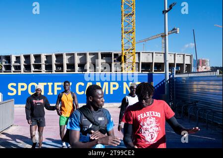 Barcelona, Spain. 21st Nov, 2023. Visitors walk past the construction work that begun June on the new Spotify Camp Nou, Barcelona football club stadium. If everything goes as planned and budgeted, the new stadium design will be completely renovated and fully operational by the end of the 2025-26 season. (Credit Image: © Xavi Lopez/SOPA Images via ZUMA Press Wire) EDITORIAL USAGE ONLY! Not for Commercial USAGE! Stock Photo