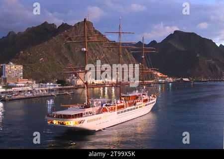 “Sea Cloud Spirit” a £78m luxury sailing cruise ship reverses into its allotted berth just after sunrise at Santa Cruz, Tenerife, April 2022. Stock Photo