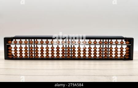 Chinese Abacus. Ancient calculator. Wooden background Stock Photo