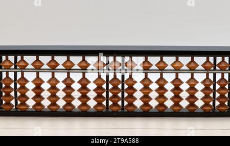 Chinese Abacus. Math calculation tool. Wooden background Stock Photo