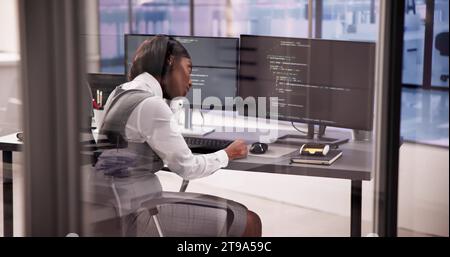 Business Engineer Analyzing Broken Code on Computer Screen Stock Photo