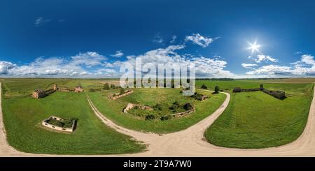 360 degree panoramic view of aerial full seamless spherical hdri 360 panorama over ruined palace, abandoned outbuildings and gravel road in equirectangular projection with zenith