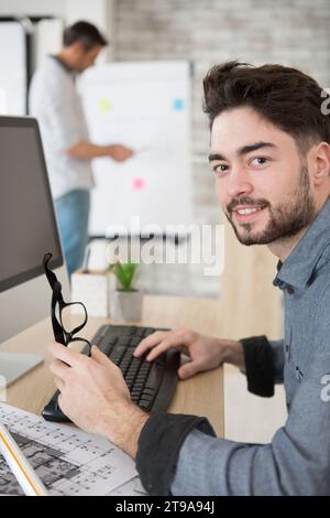 male architect using computer in the office Stock Photo