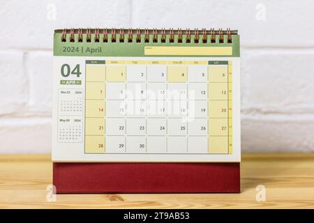 Desk calendar for April 2024 on the desktop Stock Photo