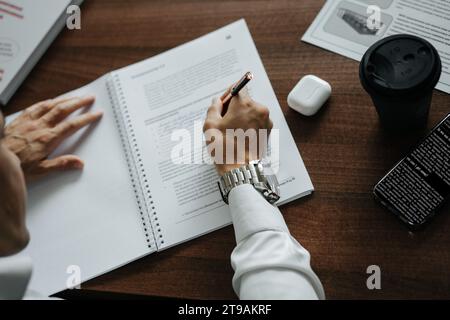 Top view of the table at which a businessman works with documents Stock Photo