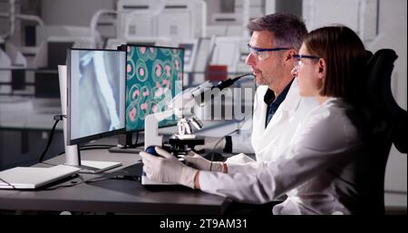 Scientist Conducts Medical Research on Blood Samples in Lab Stock Photo