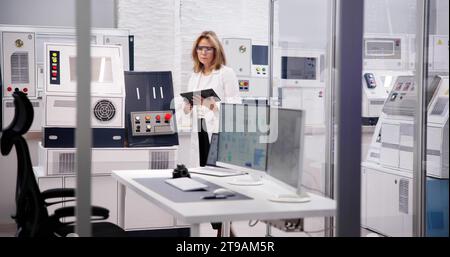 Engineer Using Medical Tablet in the Industry Factory: Innovative Engineering in the Medical Industry Stock Photo