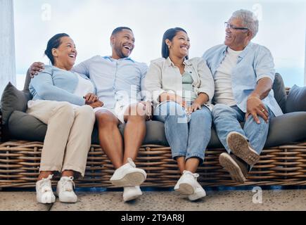 Happy family, together and laugh on couch at home, outdoors or backyard for funny joke, story or memory. Mature parents, young couple and smile on Stock Photo