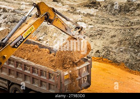 Vehicles currently loading soil. Stock Photo