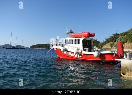 Zaton, Dubrovnik, Croatia - July 06, 2021: A fireboat designed for fighting shoreline and shipboard fires. Fireboat in Fire House Zaton near Dubrovnik Stock Photo