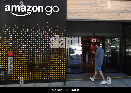 Seattle, WA, USA - August 3, 2023: People near the Amazon Go store in Seattle. Stock Photo