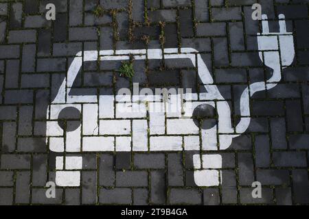 Car icon on a parking space specifically for charging electric cars Stock Photo