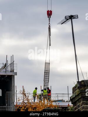 London. UK- 11.22.2023. Construction workers building a high rise building. Stock Photo