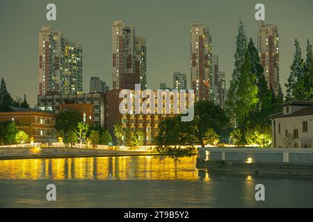 night view along suzhouhe river, buildings against sky Stock Photo