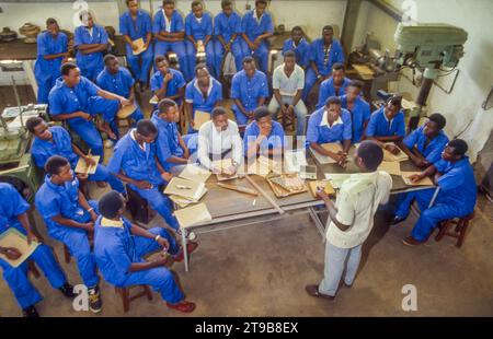 Tanzania, Kilombero - Students from the sugar institute are taught about the processing of sugar cane in the factory. Stock Photo