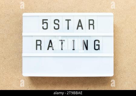Lightbox with word 5 star rating on wood background Stock Photo