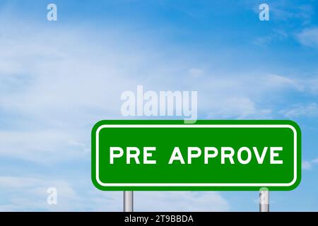Green color transportation sign with word pre approve on blue sky with white cloud background Stock Photo