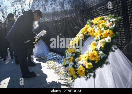 (231124) -- SHENYANG, Nov. 24, 2023 (Xinhua) -- People line up to present flowers to the memorial wall of Chinese People's Volunteers (CPV) martyrs at the CPV martyrs' cemetery in Shenyang, northeast China's Liaoning Province, Nov. 24, 2023. The remains of 25 CPV soldiers killed in the War to Resist U.S. Aggression and Aid Korea (1950-1953) were buried Friday in a cemetery in Shenyang.The remains of the fallen soldiers were returned to China from the Republic of Korea on Thursday. It was the 10th such repatriation since 2014, following a handover agreement signed between the two countries. Thi Stock Photo