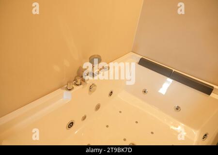 White jacuzzi in a hotel closeup. Bathroom interior Stock Photo