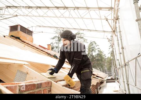 Bricklayer working on construction site Stock Photo
