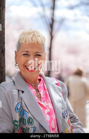 Portrait of stylish mature woman relaxing outdoors Stock Photo