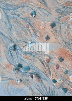 Close-up of pebbles and textured sand Stock Photo