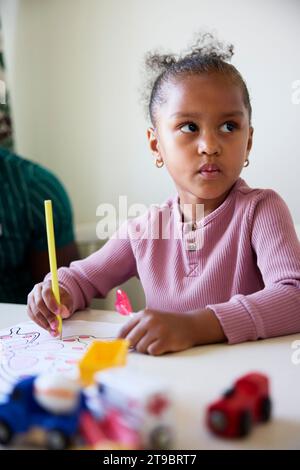 Father and daughter drawing together at  home Stock Photo