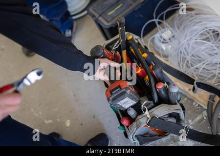 High angle view of female technician with electrical tools Stock Photo