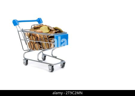 Many heap money coins in the small shopping cart, success in small business, smart shopping to save Stock Photo