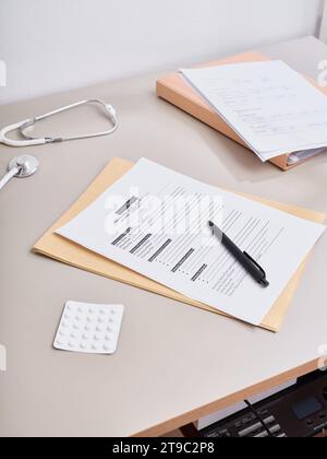 From above medical paperwork lying down on the doctor's table Stock Photo