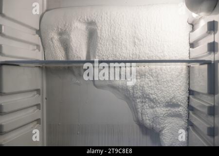 Frozen refrigerator that needs to be defrosted.  Stock Photo