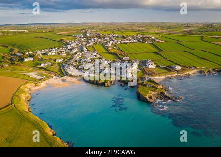 Aerial view of Trevone Beach and village in evening sunlight, Trevone, Cornwall, England. Spring (April) 2021. Stock Photo