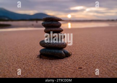 tower made of stones stacked on the beach Stock Photo