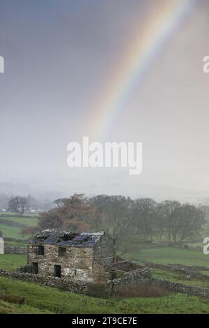 Rainbow over landscape on a stormy November morning in upper Wensleydale near Hawes, Yorkshire Dales National Park, UK Stock Photo