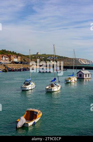 Boats moored in the harbour in Folkestone Kent UK a port town on the English Channel in south east England with blue sky above. Stock Photo