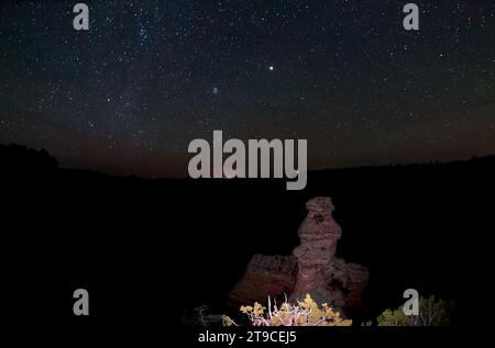 The starry night sky over Grand Canyon South Rim Arizona viewed from Duck On A Rock overlook. Stock Photo