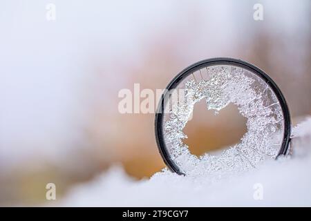 Fragmented Vision: The Beauty of a Cracked Camera Lens Filter Stock Photo