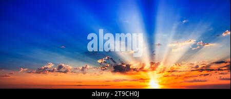 Golden Dawn: Sunlight Pierces Through the Billowing Morning Clouds Stock Photo