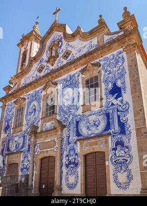 Most beautiful and iconic churches in Portugal 'Igreja de Santa Maria Maior'. In the 1940s the façade was covered with blue and white tiles azulejos. Stock Photo