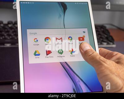 Nijkerk, Gelderland, Netherlands, September 9, 2023: Close-up of hand holding a tablet with Google Play Store on the screen. Stock Photo