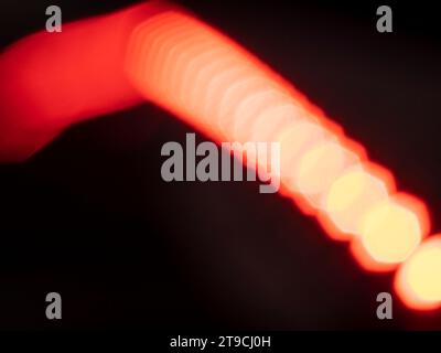 Abstract background with bokeh defocused lights on black background. Stock Photo
