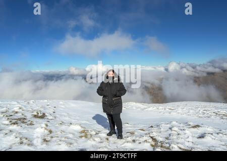 portrait young latina woman in the snow, Stock Photo