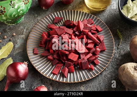 Pieces of red beet on a black plate - preparation of fermented beet kvass Stock Photo