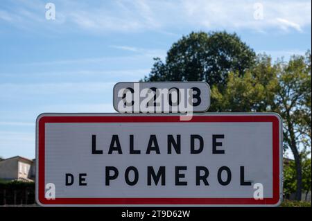 City road sign Lalande de Pomerol near Saint-Emilion wine making region, growing of Merlot or Cabernet Sauvignon red wine grapes, France, Bordeaux in Stock Photo