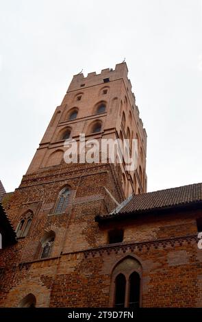 MALBORK, POLAND - 6 NOVEMBER 2023: A tower of the world's largest castle, once the seat of the grand masterle of the Teutonic Order originally built i Stock Photo