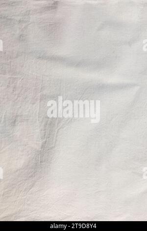 Eco-friendly natural material. White cotton fabric slightly wrinkled texture. Textile background. Stock Photo