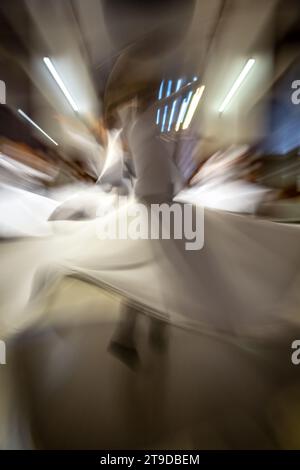 Dancers, whirling dervishes ceremony, Sirkeci Train Station, Istanbul, Turkey Stock Photo