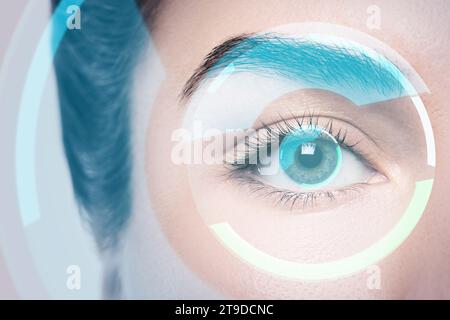 Close-up of female eye with HUD display. Concepts of augmented reality and biometric iris recognition or visual acuity check-up Stock Photo